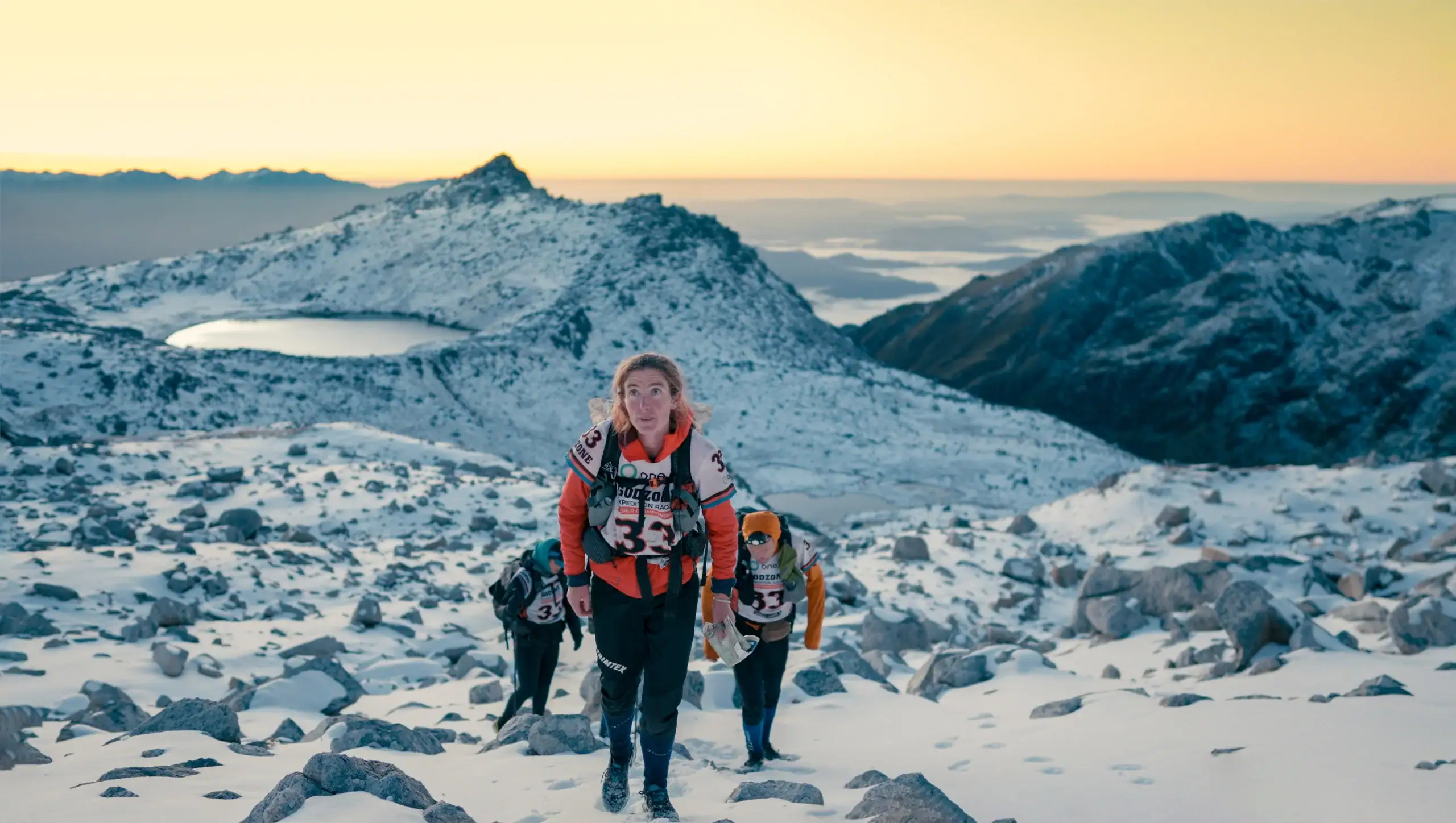 People racing in the mountains in the snow